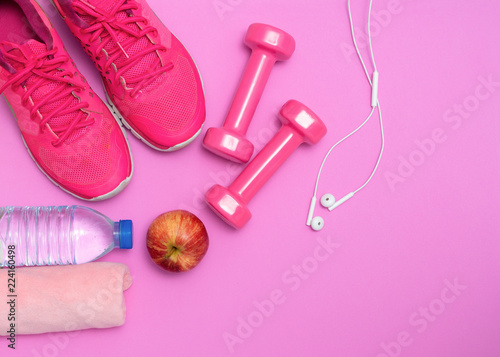 Healthy lifestyle, Food, Sport or athlete's equipment on bright background. Flat lay. Top view with copy space. Fitness concept with dumbbells and fresh fruits © sutthinon602