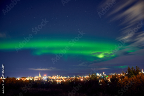 northern lights above Reykjavik in Iceland at night