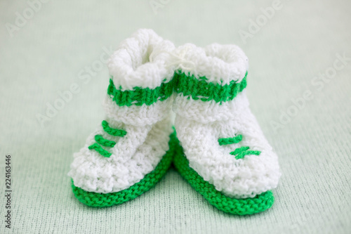 booties newborn baby. booties white green. knitted baby socks