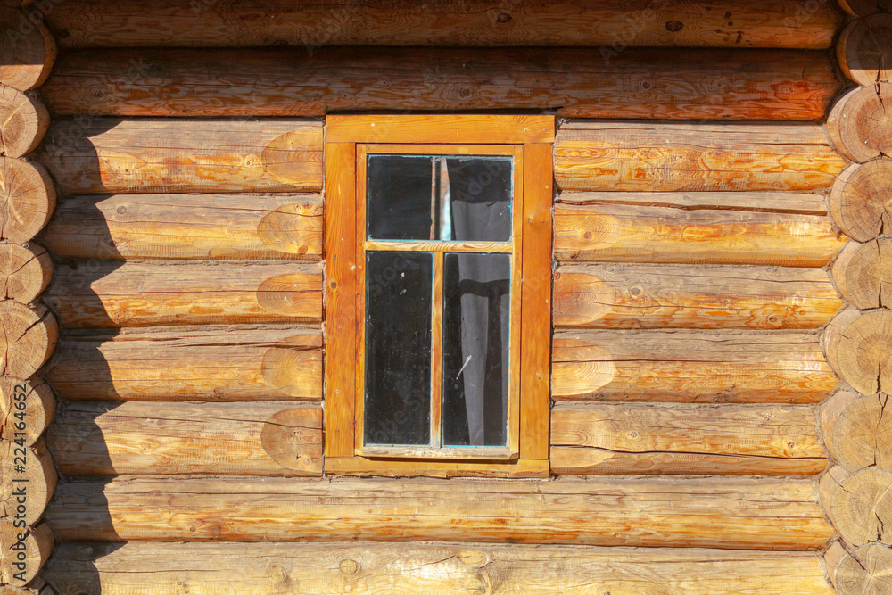 Window in the house with a log house Window in the house with a log house