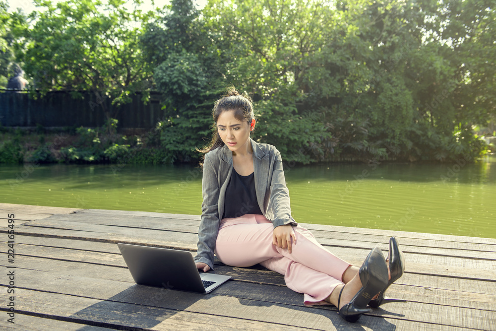 Young asian business woman working using laptop Young asian business woman working using laptop