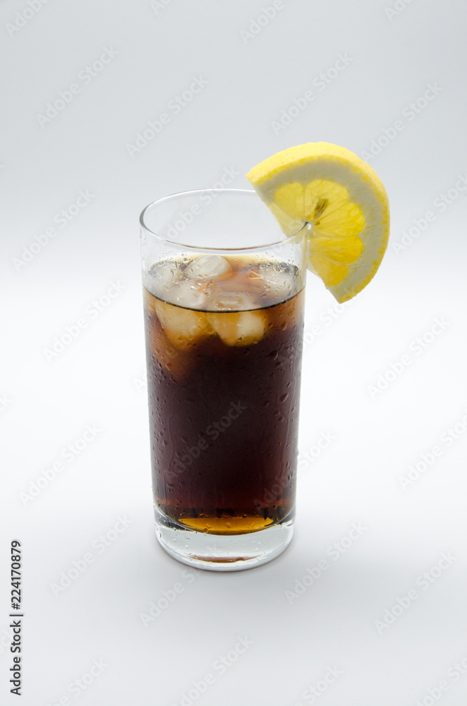 cold soda with ice and lemon