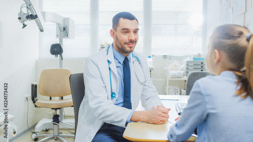 Little Girl Visits Doctor's Office. Friendly Pediartrist Talks with Smart Little Girl. Child Health Examination. Little Girl Visits Doctor's Office. Friendly Pediartrist Talks with Smart Little Girl. Child Health Examination.