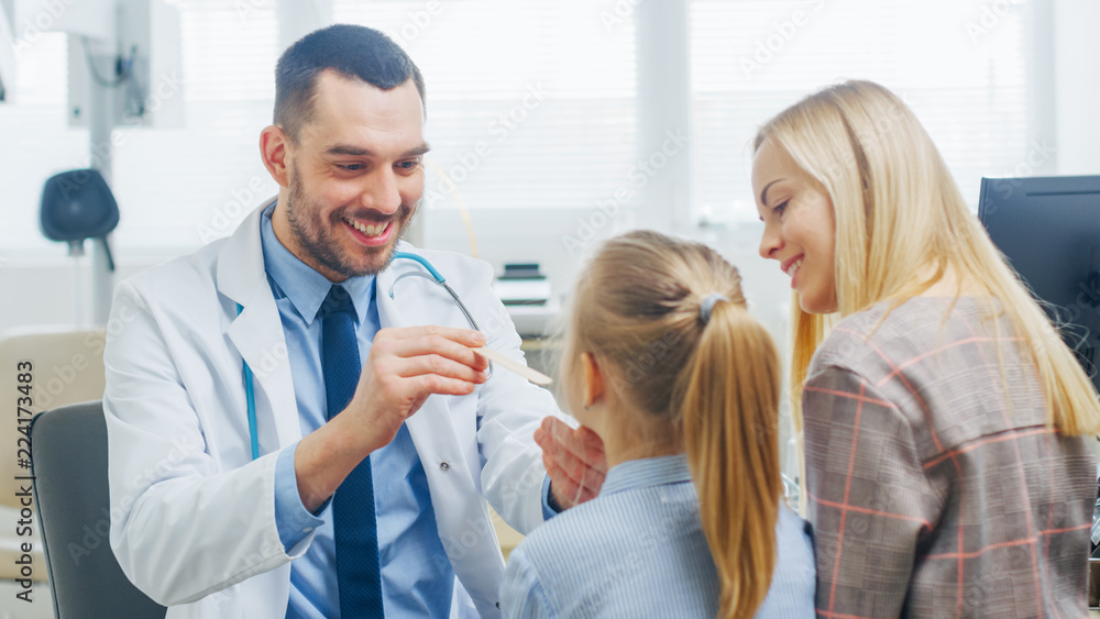 Friendly Doctor Checks up Little Girl's Sore Throat, Mother is Present for Support. Modern Medical Health Care, Friendly Pediatrician and Bright Office.