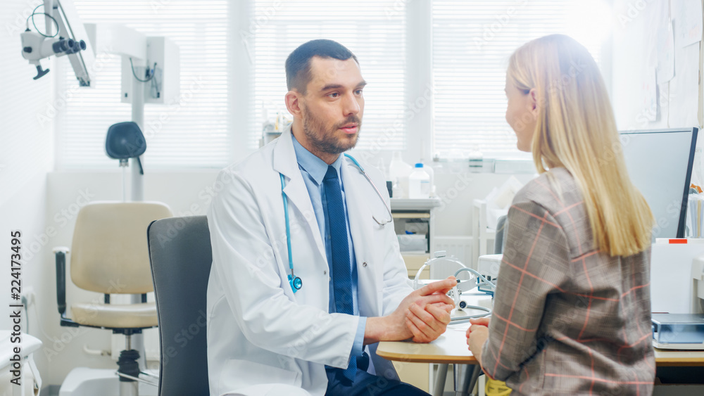 In Medical Office Concerned Doctor Talks with a Beautiful Blonde Woman. Health Care Professional Consultation in the Bright Modern Office. In Medical Office Concerned Doctor Talks with a Beautiful Blonde Woman. Health Care Professional Consultation in the Bright Modern Office.