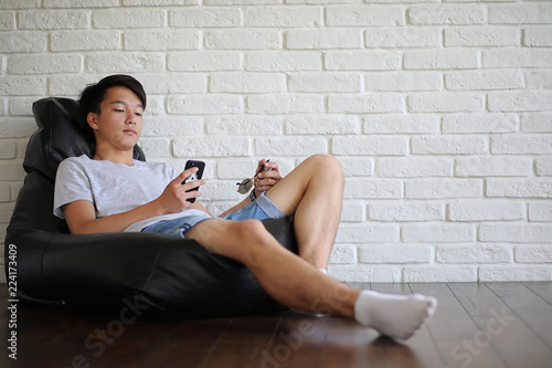 Asian student sitting on pillow and getting ready for exam