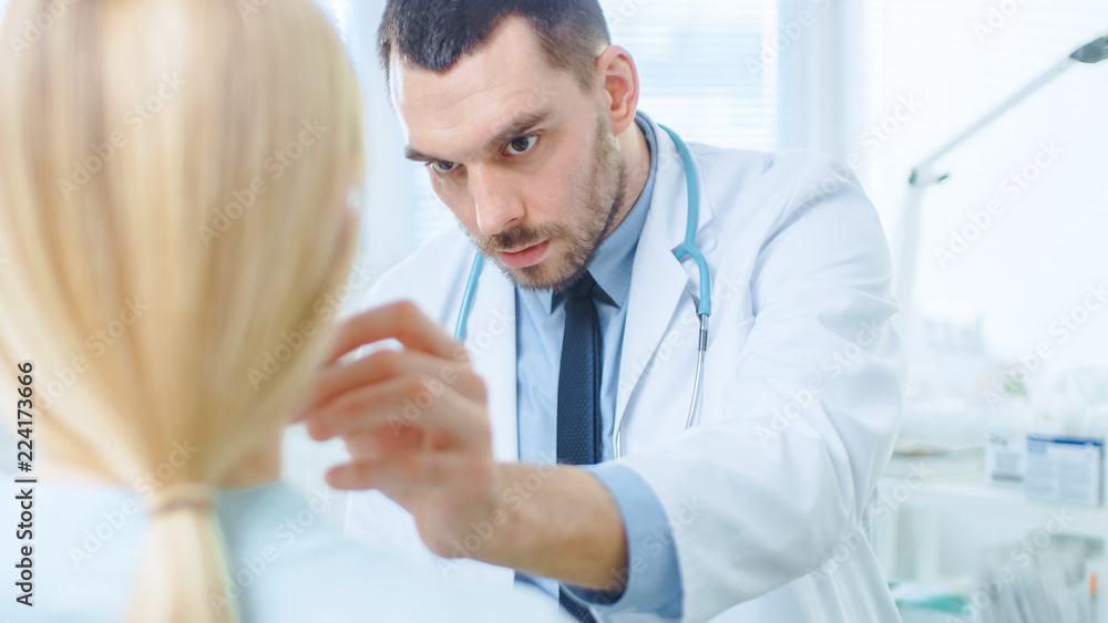 Over the Shoulder Shot of a Female Patient Sitting Patiently While Plastic / Cosmetic Surgeon Draws Lines on Her Face for Facelift Operation. Over the Shoulder Shot of a Female Patient Sitting Patiently While Plastic / Cosmetic Surgeon Draws Lines on Her Face for Facelift Operation.