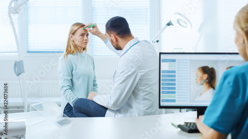 Plastic / Cosmetic Surgeon with Female Patient, He Draws Lines on Her Face for Future Facelift Operation. Nurse Plans on Computer Patient's Facelift, Cheek Bones and Nose Correcting Procedures.