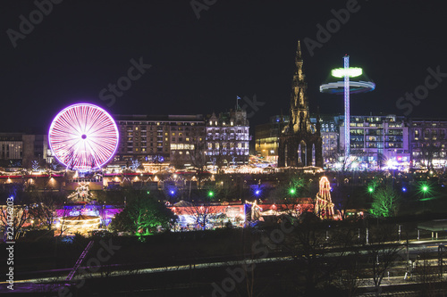 Christmas market in Edinburgh and Walter Scott Monument at night
