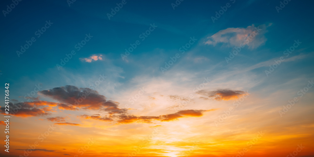 Fototapeta Sunset Sunrise Sky Background. Bright Dramatic Sky In Yellow, Or