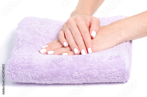 Towel female hands manicure on white background isolation
