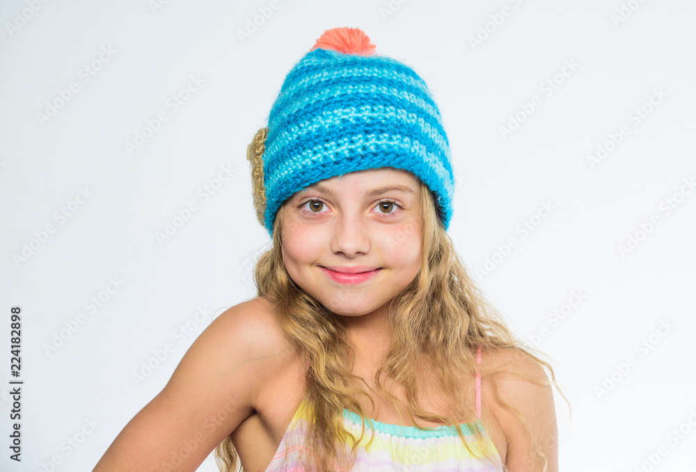 Difference between knitting and crochet. Fall winter season accessory. Free knitting patterns. Knitted hat with pompon. Girl long hair happy face white background. Kid wear warm soft knitted blue hat Difference between knitting and crochet. Fall winter season accessory. Free knitting patterns. Knitted hat with pompon. Girl long hair happy face white background. Kid wear warm soft knitted blue hat