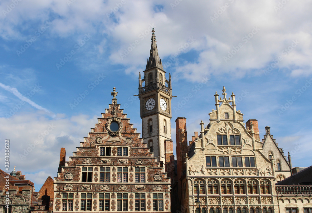 View of the House of Grain Measures in the Renaissance style, the House of the Franks-Boatmen in the Gothic style and the tower of Old Post office. Ghent, Belgium.