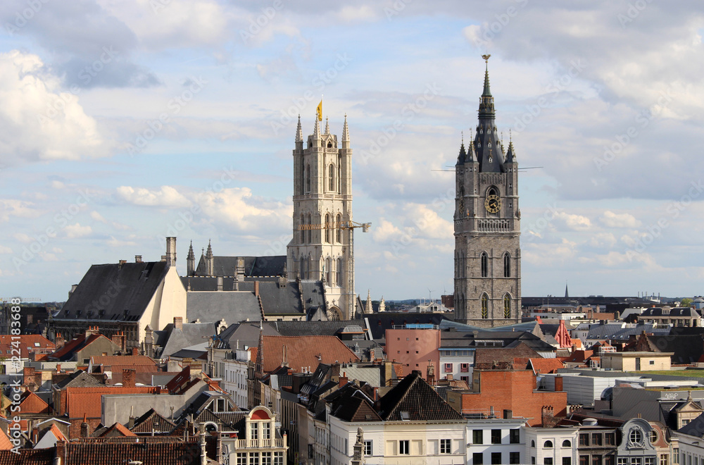 View of the roofs of the historic center of Ghent, the Saint Bavo Cathedral and Belfry of Ghent. Belgium.
