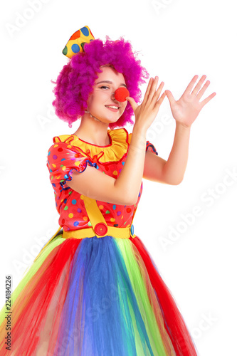 Happy young clown girl on white background