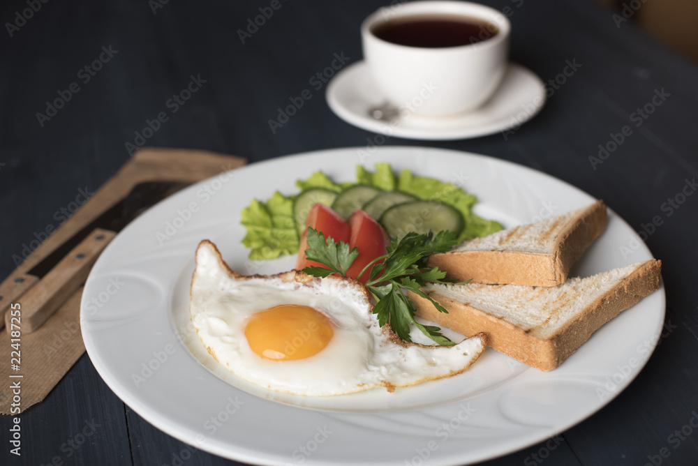 breakfast - fried egg, tomatoes, salad, coffee and toast breakfast - fried egg, tomatoes, salad, coffee and toast