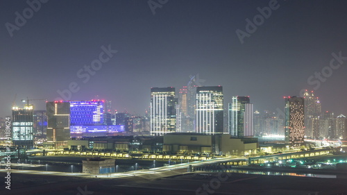 Buildings on Al Reem island in Abu Dhabi night timelapse from above. © neiezhmakov