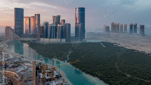 Buildings on Al Reem island in Abu Dhabi timelapse from above. photo