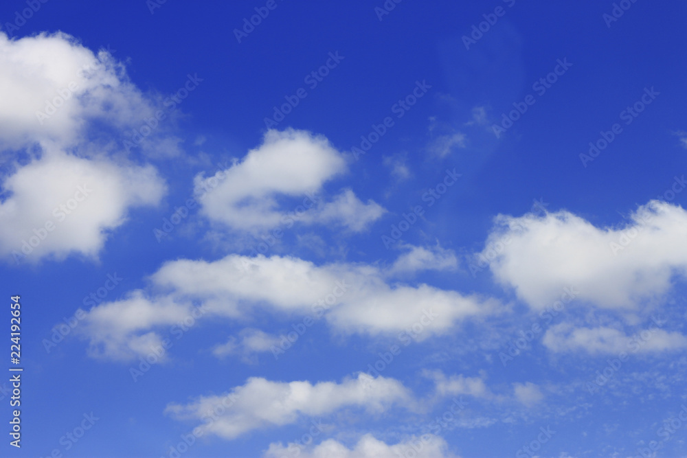 Idyllic white cloud on blue sky. Cloudscape background with fluffy cloud on blue summer sky wallpaper texture Idyllic white cloud on blue sky. Cloudscape background with fluffy cloud on blue summer sky wallpaper texture