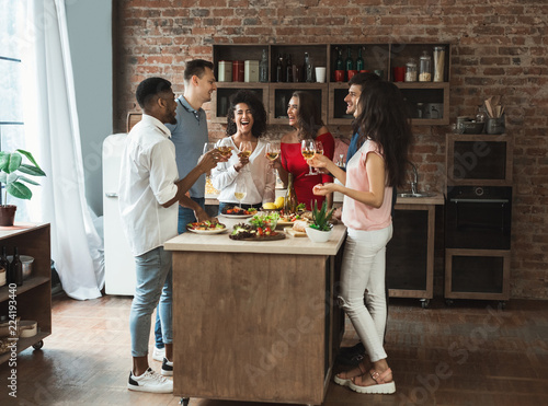 Sticker Group of cheerful young people enjoying dinner