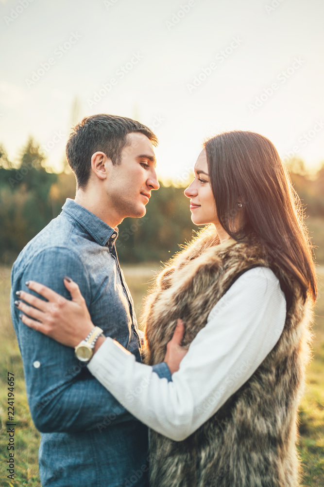 Fototapeta premium Happy couple in love relaxing in the field.