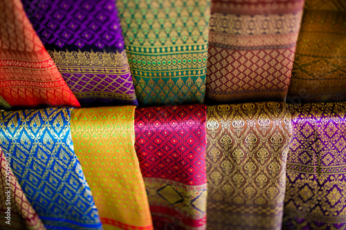 Beautiful Row of Traditional Colorful Thai Silk Fabric Textile and background.