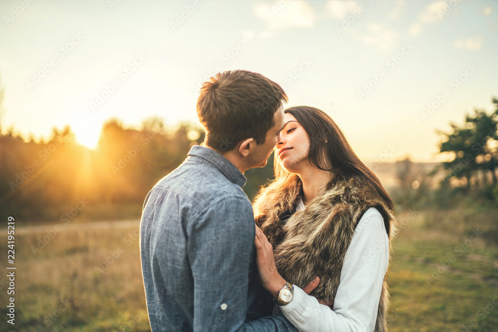 Happy couple in love relaxing in the field. Happy couple in love relaxing in the field.