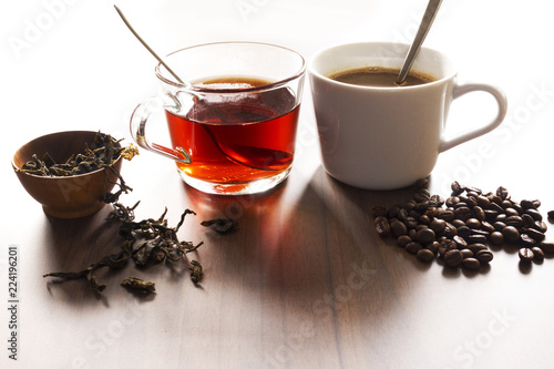 Obraz na plátne Coffee and tea with coffee bean and tea leaves on wooden floor.
