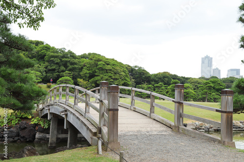 Closeup of vintage wooden bridge over waterway in public park