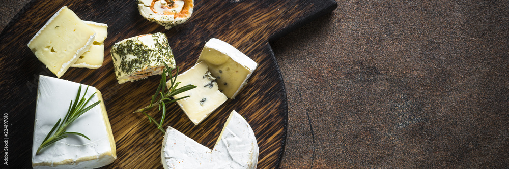 Cheese platter on dark stone table. Cheese platter on dark stone table.