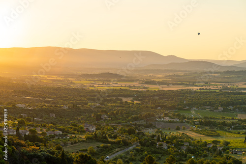 Hot-Air Balloon rising over French countryside at sunrise  Provence  France