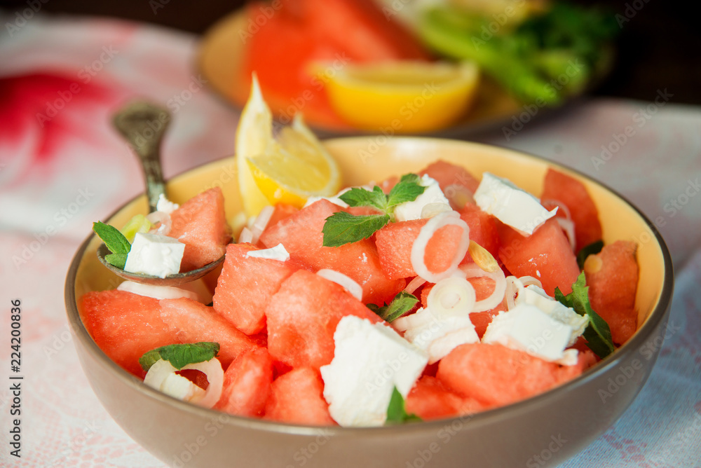 Summer light salad of watermelon, lime, mint and cheese Summer light salad of watermelon, lime, mint and cheese