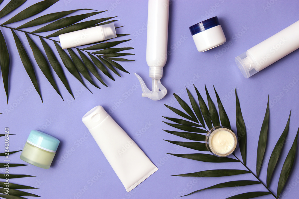 natural cosmetics and green leaf on a colored background top view. flatlay natural cosmetics and green leaf on a colored background top view. flatlay