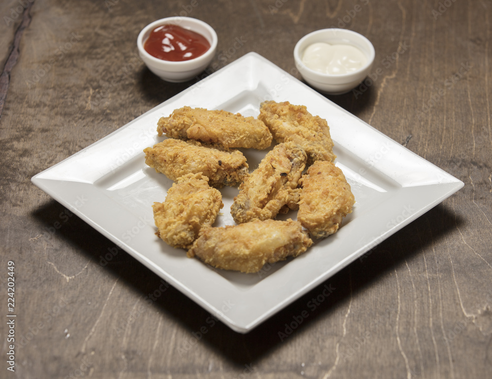 homemade crispy fried chicken on white homemade crispy fried chicken on white