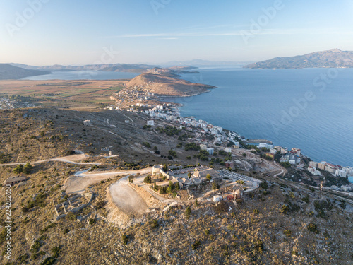 Aerial view of Lekuresi Castle (Saranda, Albania) with a view of Corfu, Greece in the background photo