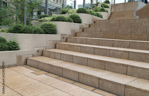 Closeup of modern designed outdoor granite stairs with natural background after raining.  © Amphon