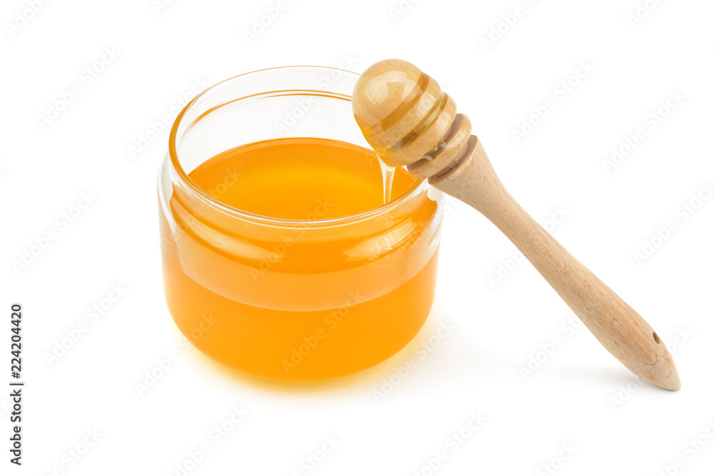 Pot with honey and drizzler isolation on a white background . Pot with honey and drizzler isolation on a white background .