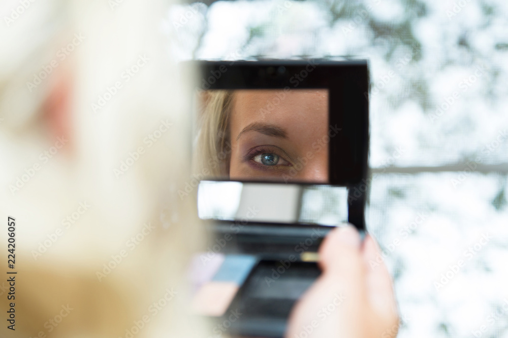 Young beautiful bride applying wedding make-up Young beautiful bride applying wedding make-up