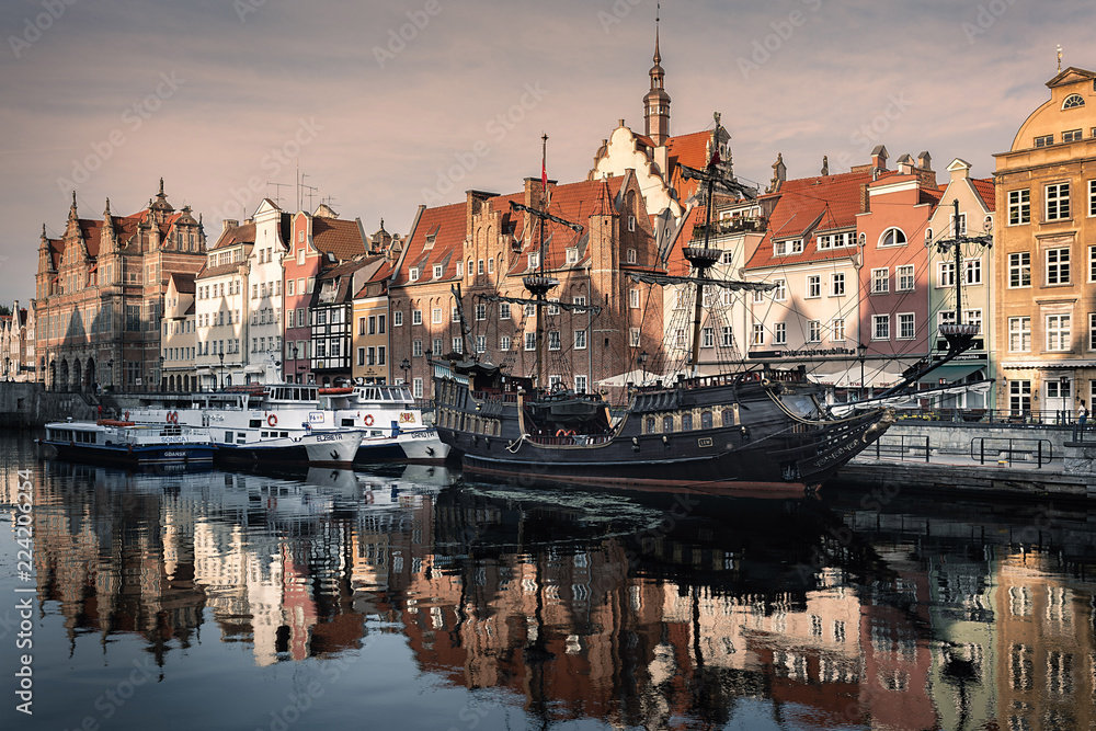 Pirate ship at Motlawa river in Gdansk at sunrise, Poland. Gdansk is city with beautiful architecture. Harobour at the sunrise