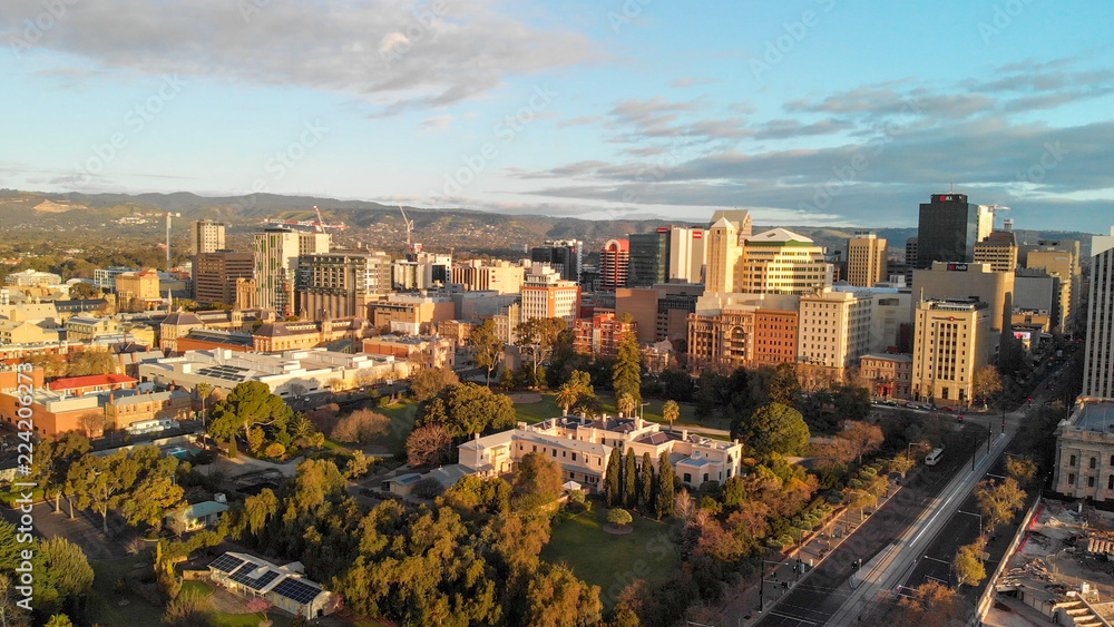 ADELAIDE, AUSTRALIA - SEPTEMBER 16, 2018: Aerial view of city skyline at sunset. Adelaide is the main city of South Australia State