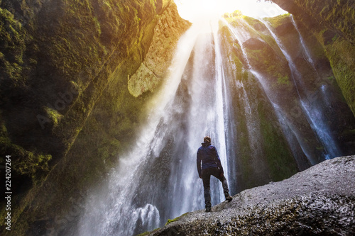 Gljufrabui waterfall in South Iceland,  adventurous traveller standing in front of the stream cascading into the gorge or canyon, hidden Icelandic landmark, inspirational landscape