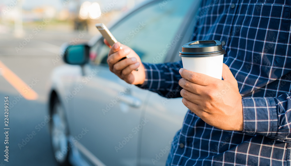 Young man holding coffee paper cup