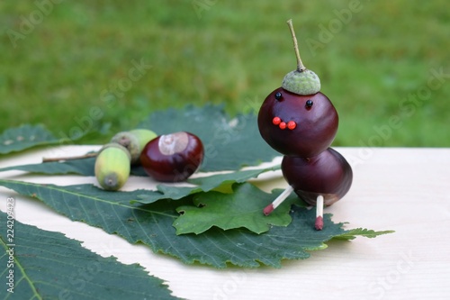 Figurine made of chestnuts and acorns