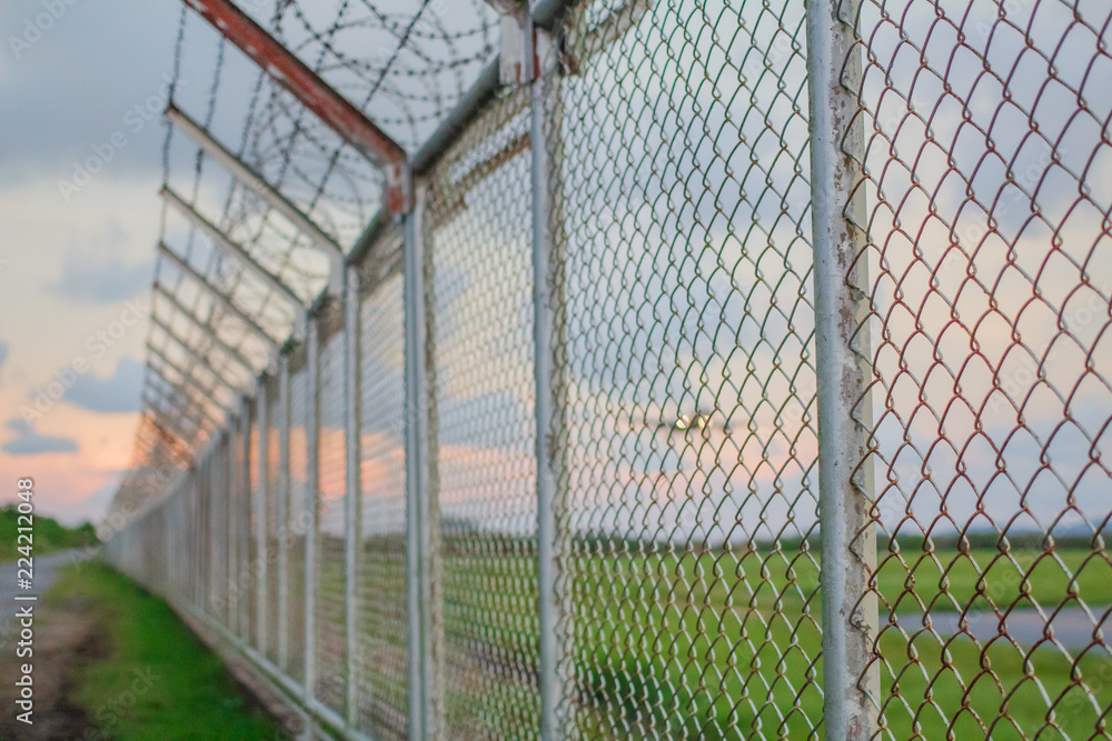 wire mesh steel with green grass background in Phuket Thailand wire mesh steel with green grass background in Phuket Thailand