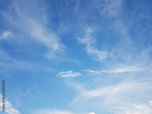 Cirrus clouds on a clear blue sky. Weather forecast. Water in a gaseous state in nature. The atmosphere of the earth. The effect of humidity on agricultural production. The symbol of freedom, holines.