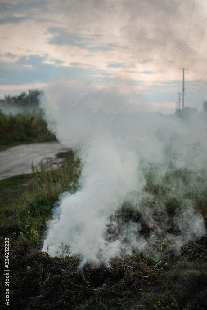 Smoke of a fading fire on the street. For use as a texture