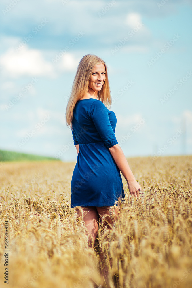Woman walking on wheat field. Woman walking on wheat field.