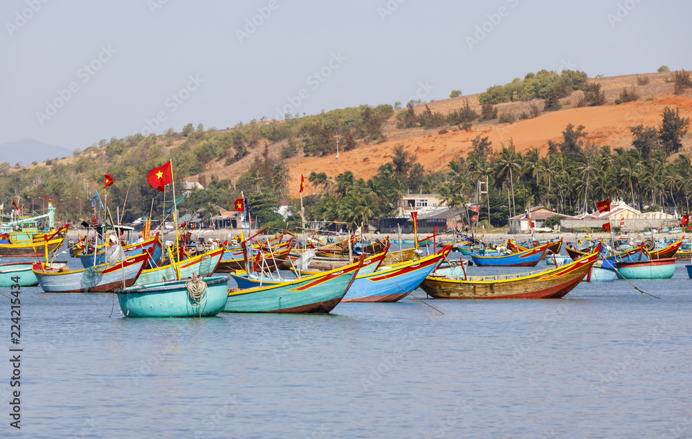 Fishing harbor full of boats in a bay in Mui Ne, Vietnam Fishing harbor full of boats in a bay in Mui Ne, Vietnam