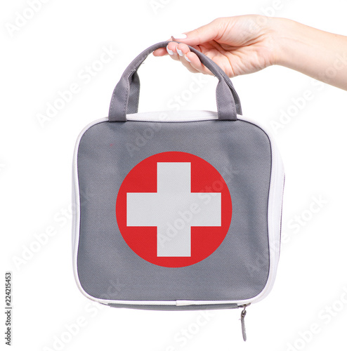 First-aid kit bag in hand on a white background isolation