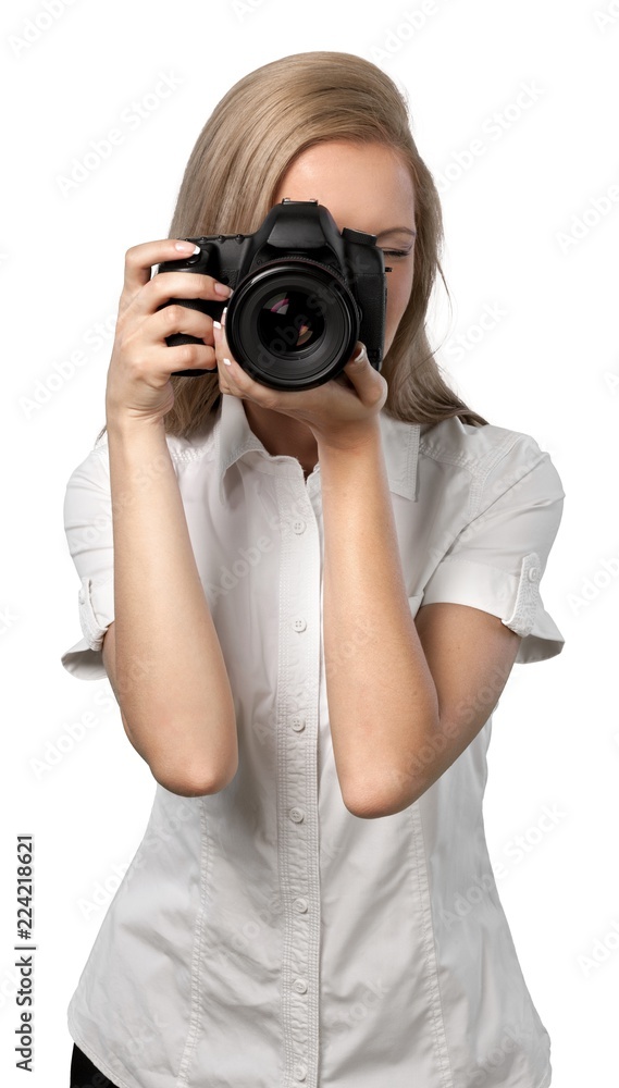 Woman taking photographs with a DSLR Woman taking photographs with a DSLR